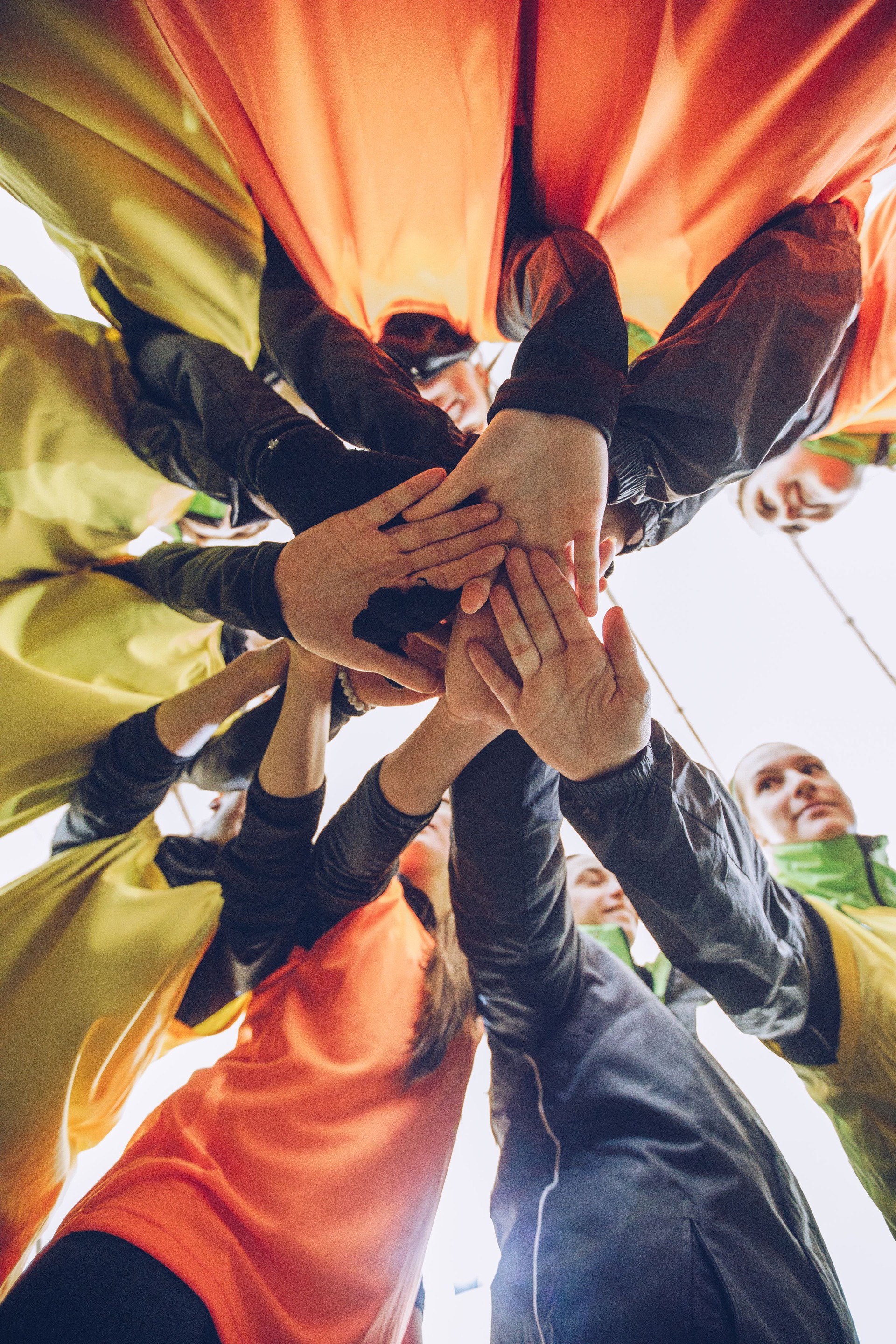 Female soccer team huddling