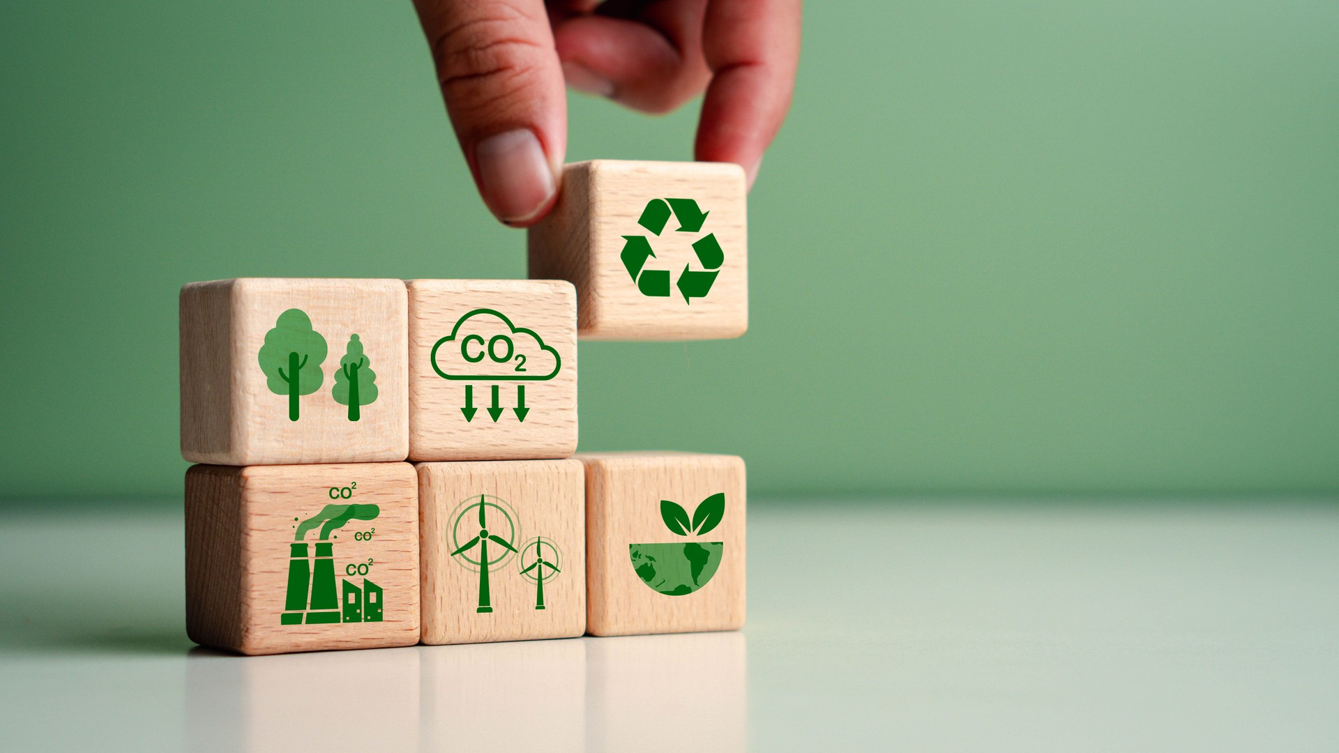 Reducing carbon footprint concept, and CO2 emissions target on wooden cubes. Green Energy and Sustainability Concept. sustainability, environmental conservation, target sustainability